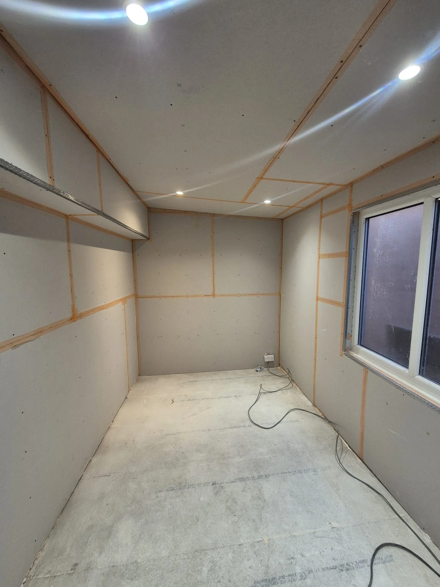 Room at the boarding stage, with wall and ceiling boards visible